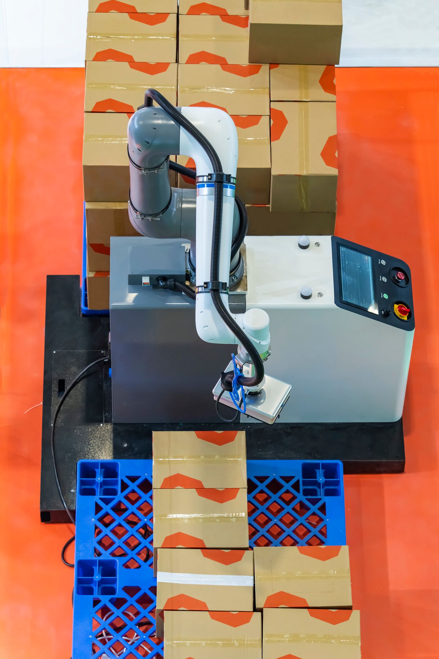 Depalletizing Robot arm taking boxes off of a pallet