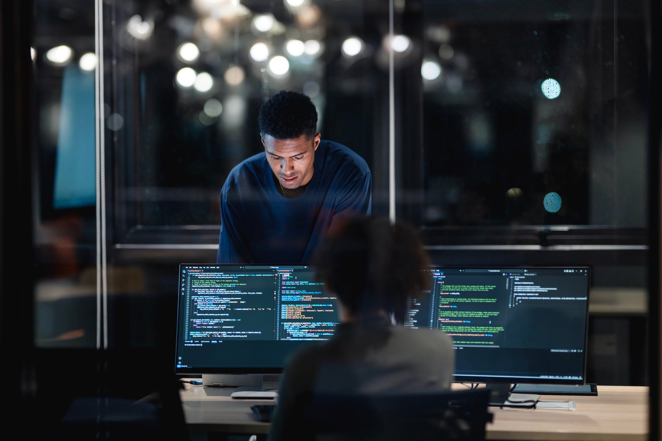 Two IT professionals working on data security