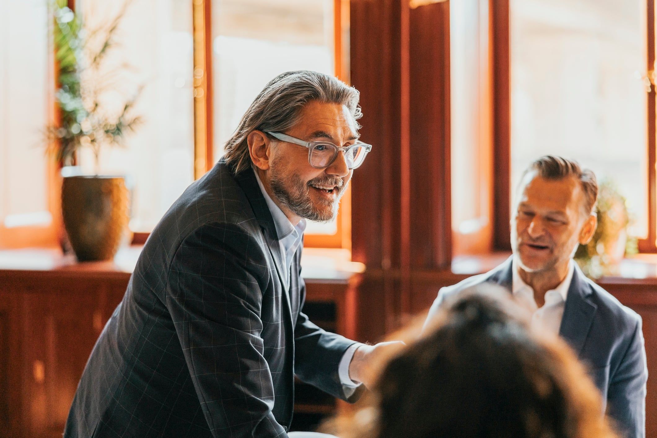 Business professionals speaking together