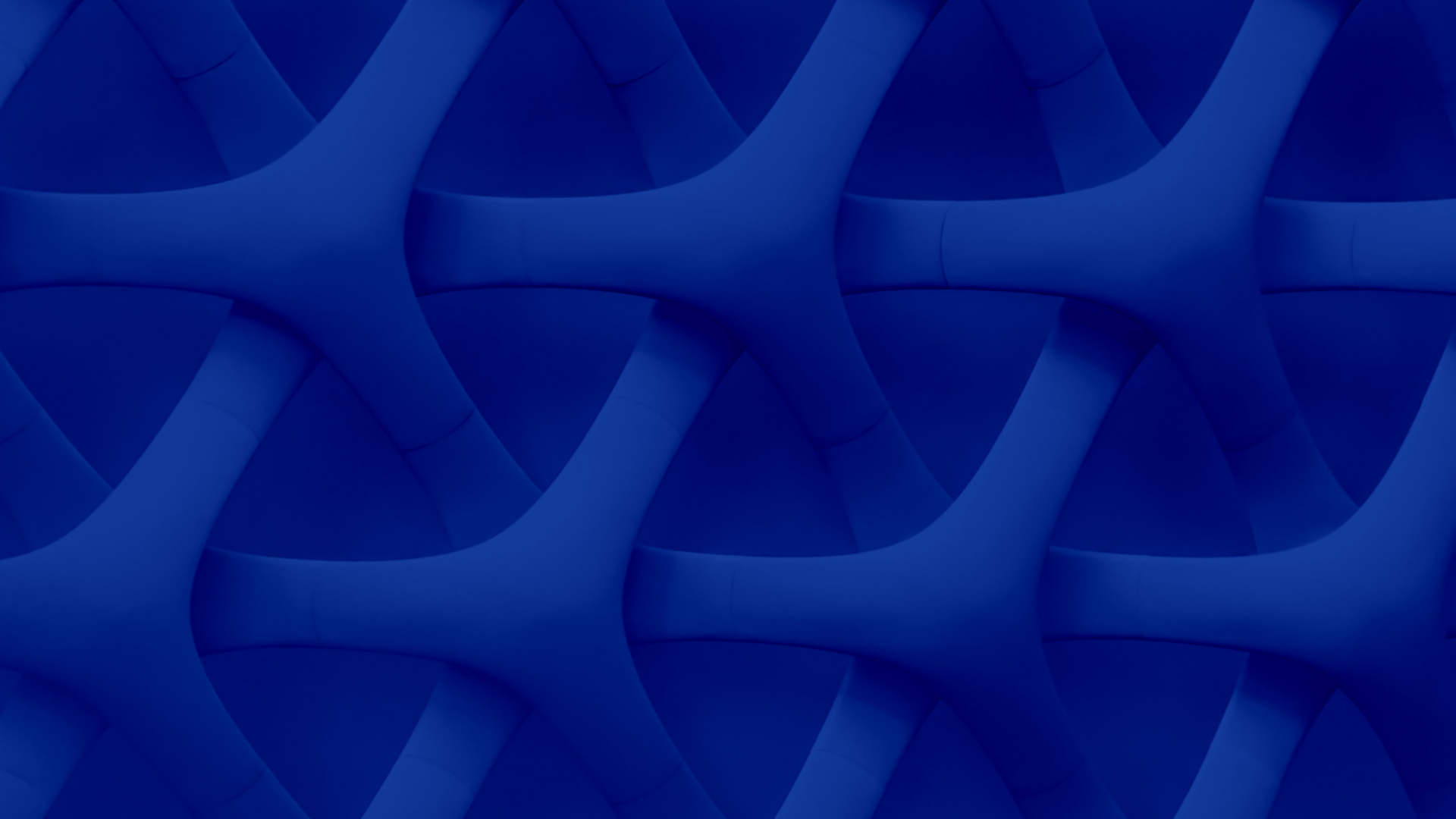 Abstract deep-blue geometric pattern of interlocking three-way forms, representing the connected tesma technology management platform.