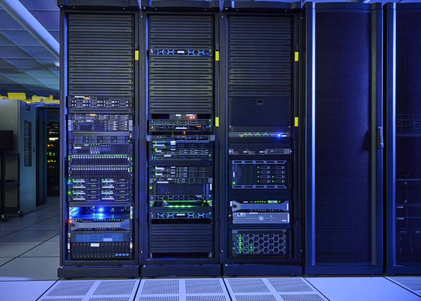 Open server racks with blue and green status lights on a raised data center floor, used for on-premises GPU infrastructure